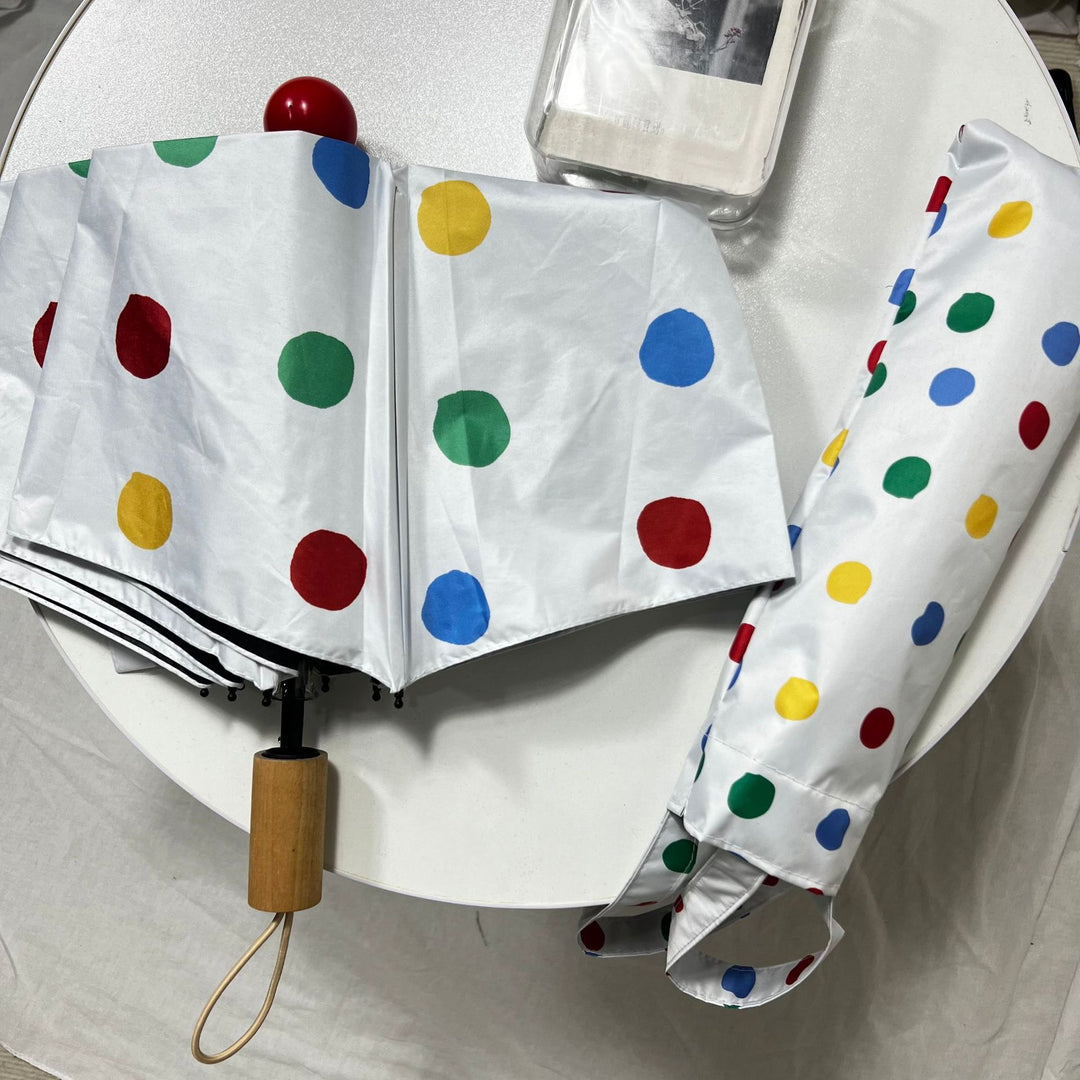 Ladies designer foldable umbrella with colorful polka dot pattern Stornfield