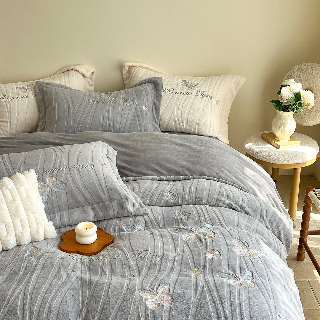 Cozy microfiber bedding with embroidered butterfly designs