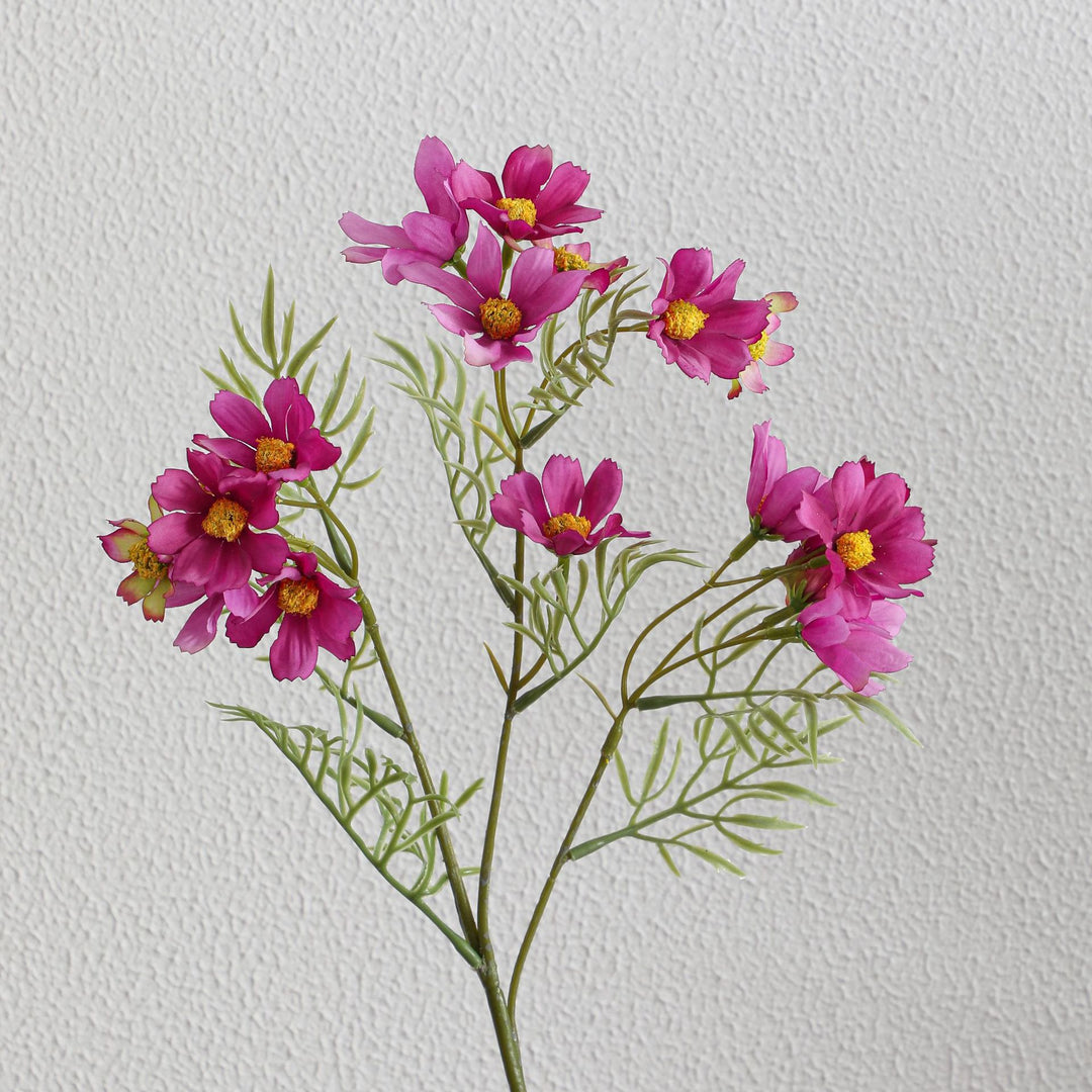Artificial flower branch with bright pink flowers