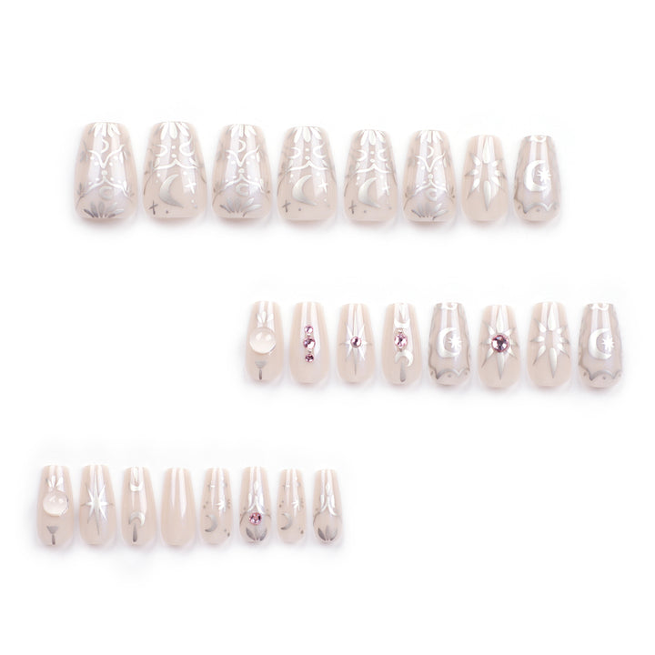Artificial nail art with elegant rhinestone and glitter effects Stornfield