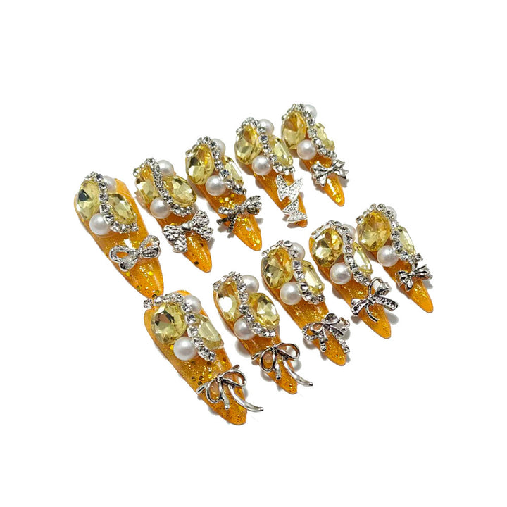 Glamorous artificial nails with rhinestones and pearl embellishments Stornfield