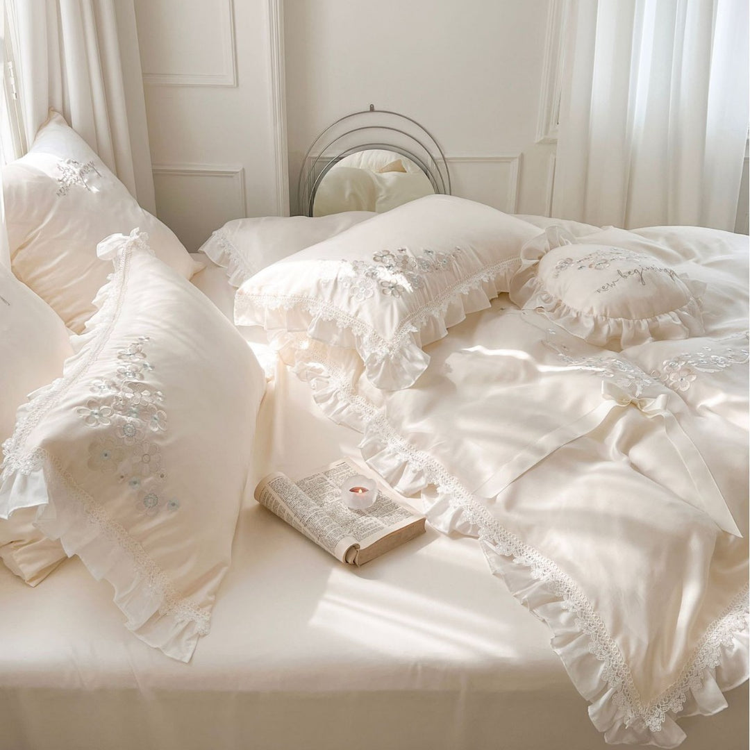 Romantic cotton satin bedding set with ruffles, floral embroidery, and satin bows