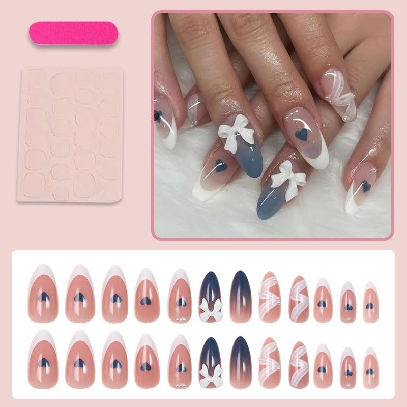 Artificial nail set with elegant bows and heart-shaped accents Stornfield