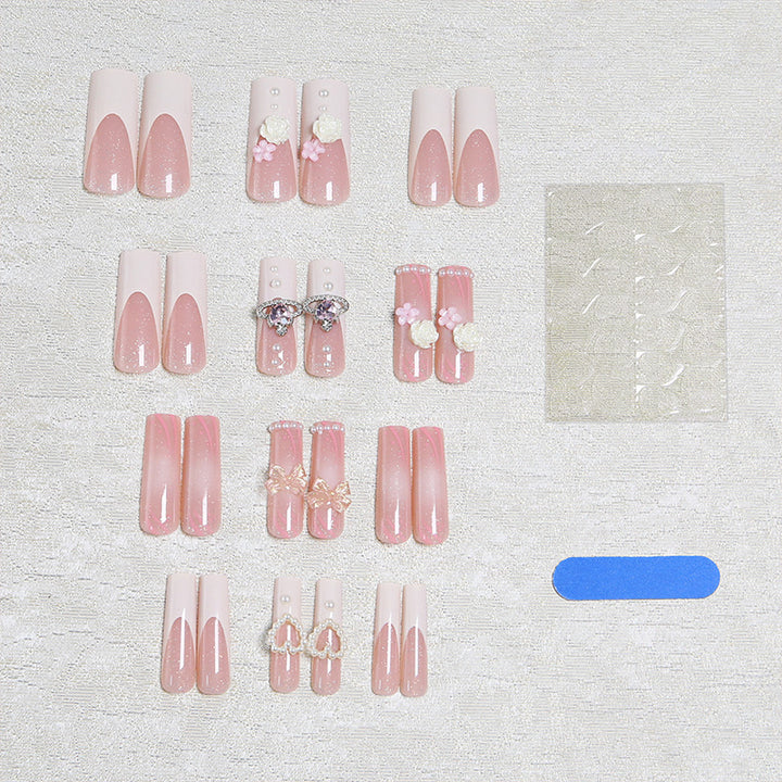 Artful nail tips with pearl and bow motifs Stornfield