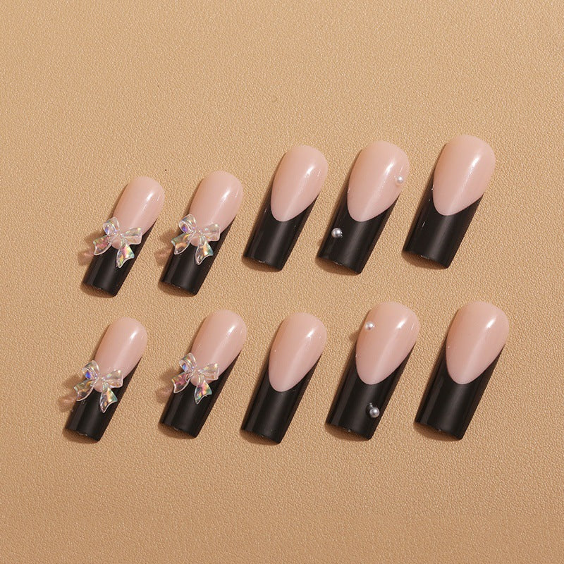 Nail decoration with elegant bows and rhinestones Stornfield