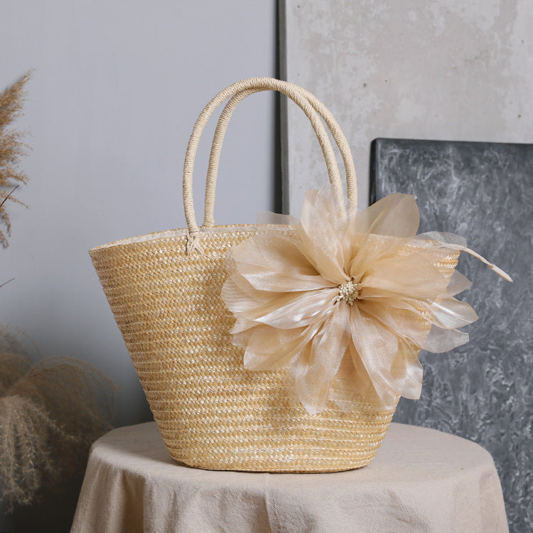 Stylish basket bag with eye-catching flower detail Stornfield