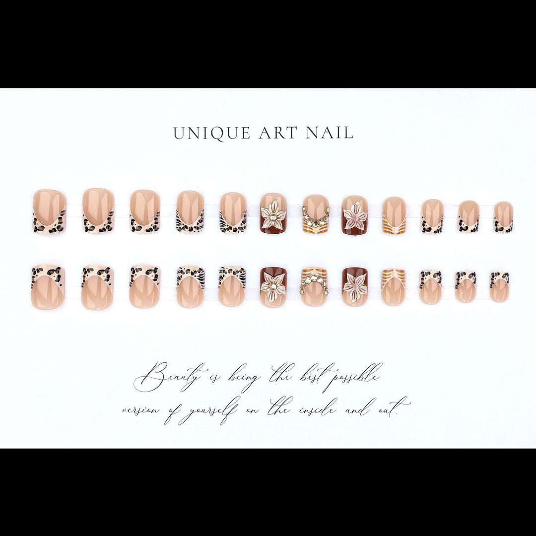 Artificial nail set with floral embellishments and elegant glitter details Stornfield