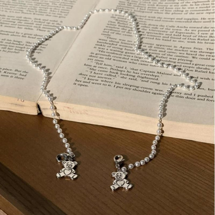 Playful pearl necklace with gold pendants Stornfield