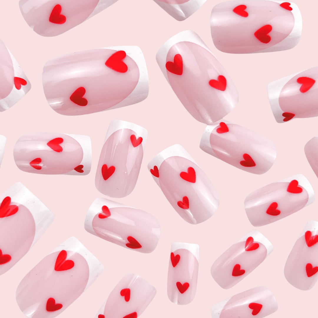 Heart-Embellished French Tip Nail Art Stornfield