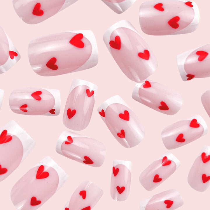 Heart-Embellished French Tip Nail Art Stornfield