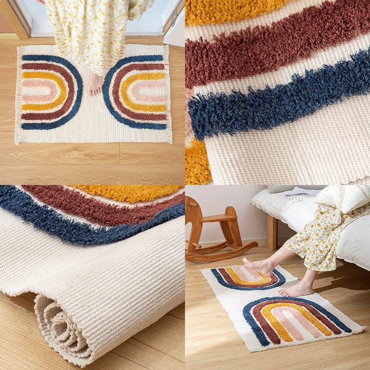 Hand-tufted cotton bath mat with botanical pattern and decorative fringes