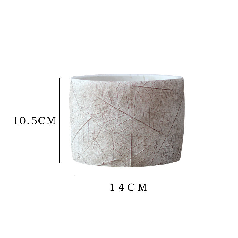 Decorative plant container made of handmade ceramic with leaf pattern Stornfield