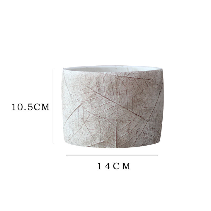 Decorative plant container made of handmade ceramic with leaf pattern Stornfield