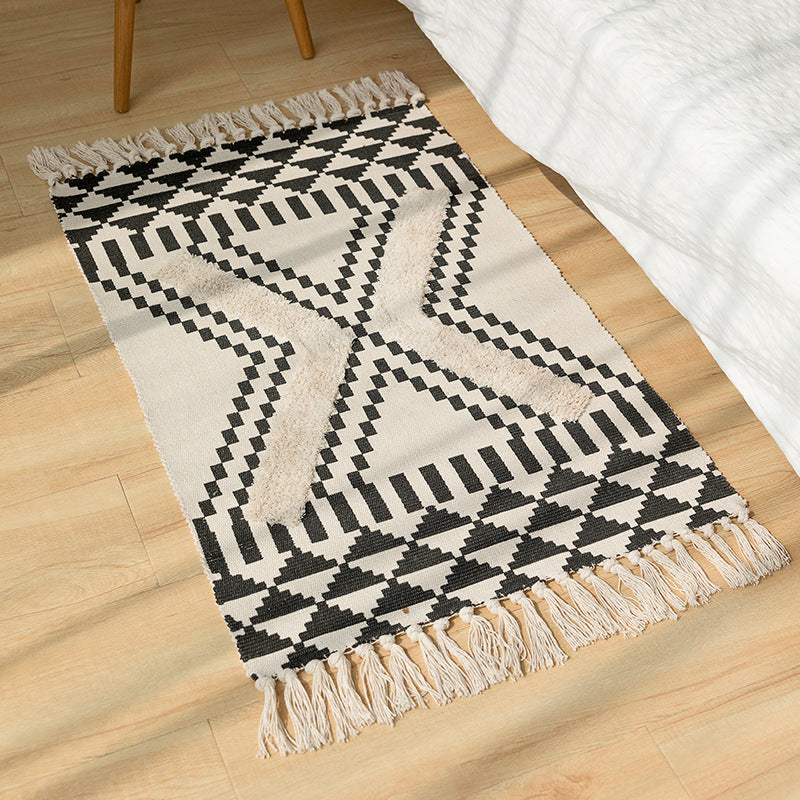 Handwoven cotton runner with pompom tufting and decorative fringes