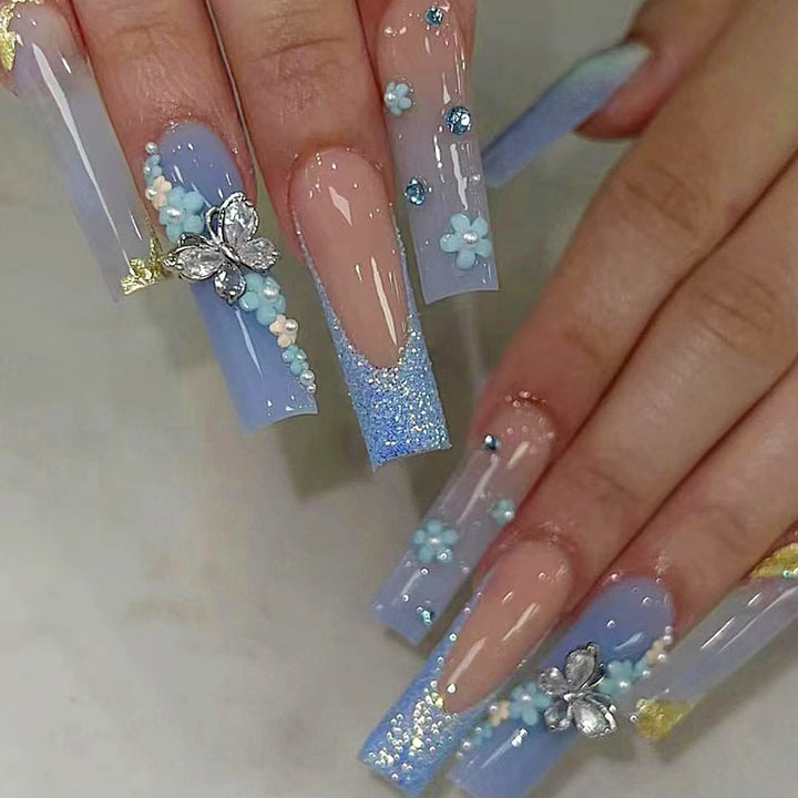 Artistic acrylic nails with flower and glitter design Stornfield