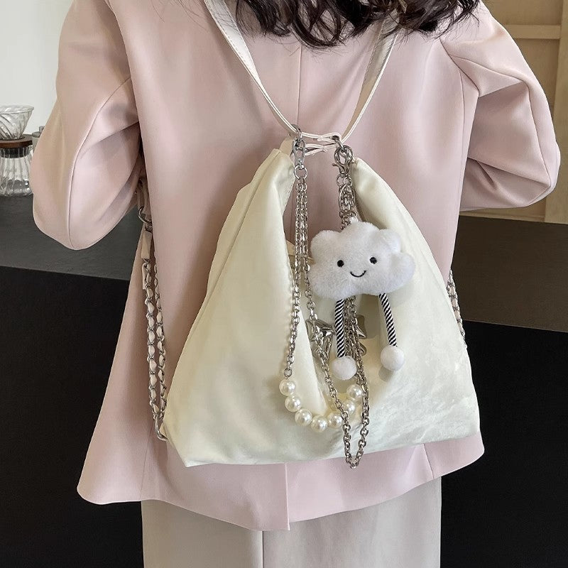 Fashionable handbag with unique pendant and chain accents Stornfield