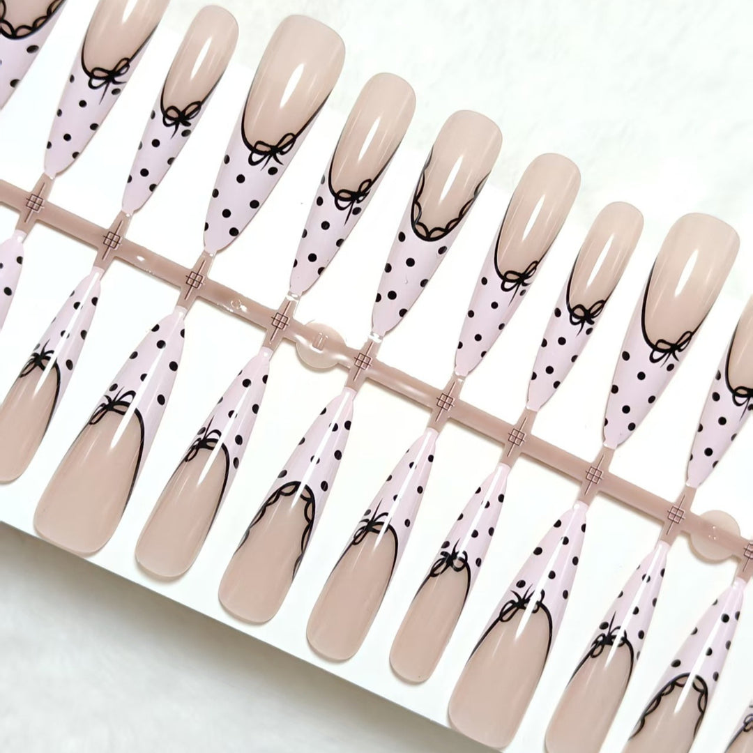 Elegant artificial nails with bow design and dots Stornfield