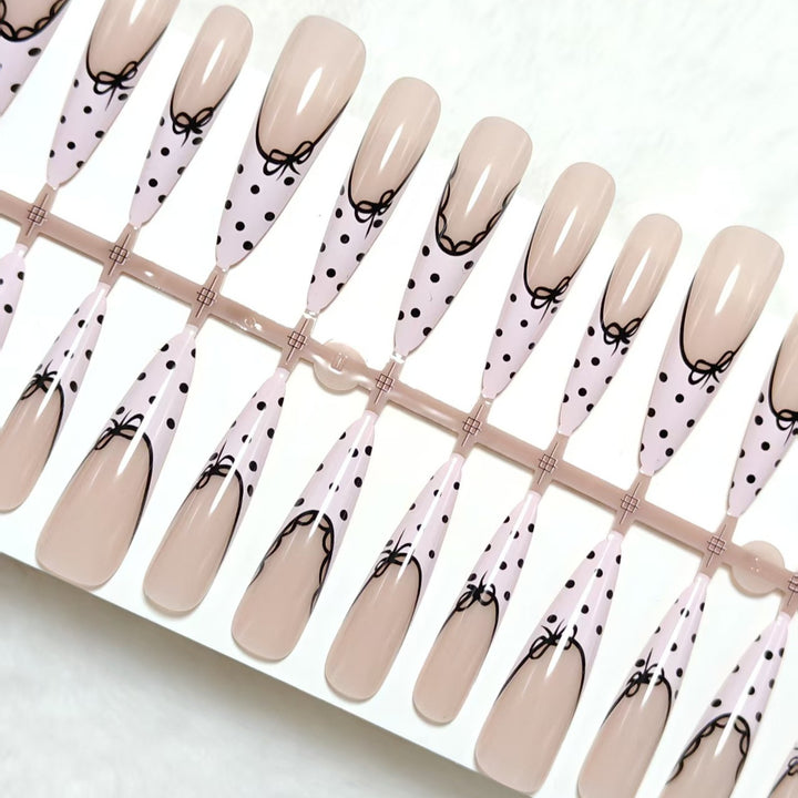 Elegant artificial nails with bow design and dots Stornfield