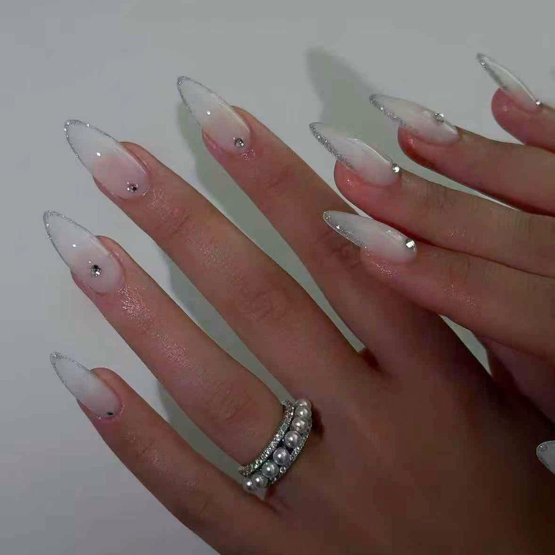 Acrylic nail set with elegant tips and sparkling accents Stornfield