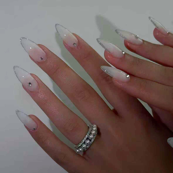 Acrylic nail set with elegant tips and sparkling accents Stornfield