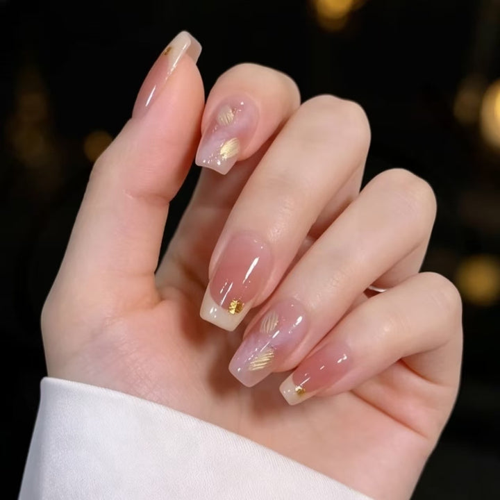 Elegant French Tip Nail Extensions with Gold Accents