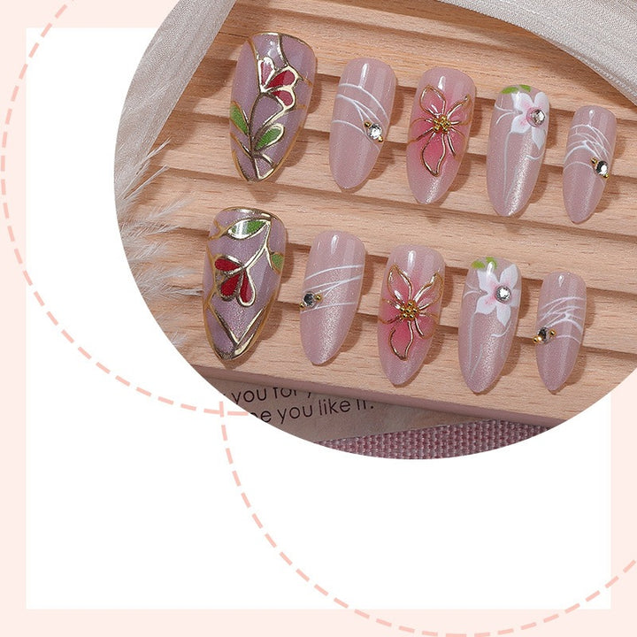 Nail art set with filigree floral decorations and shiny details Stornfield