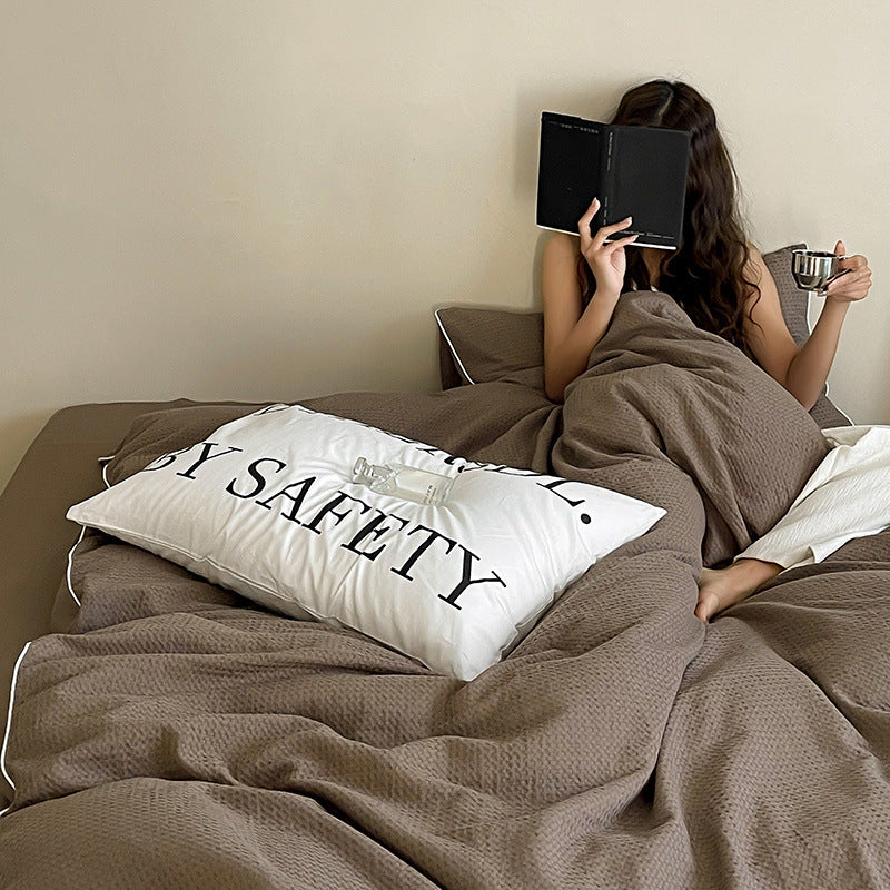 Textured cotton waffle duvet cover with pillowcases and fine contrasting piping