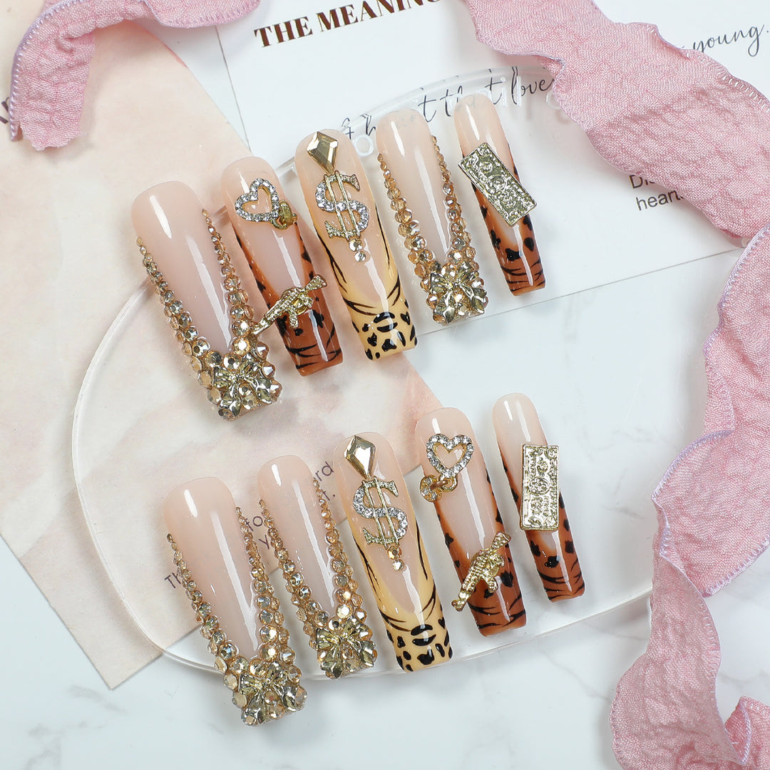 Acrylic nail set with luxurious glitter and animal motifs Stornfield