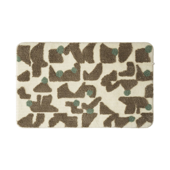 Bath mat with raised tuft-relief and non-slip underside