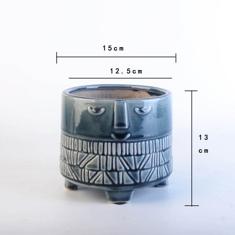 Decorative plant pot with facial features Stornfield