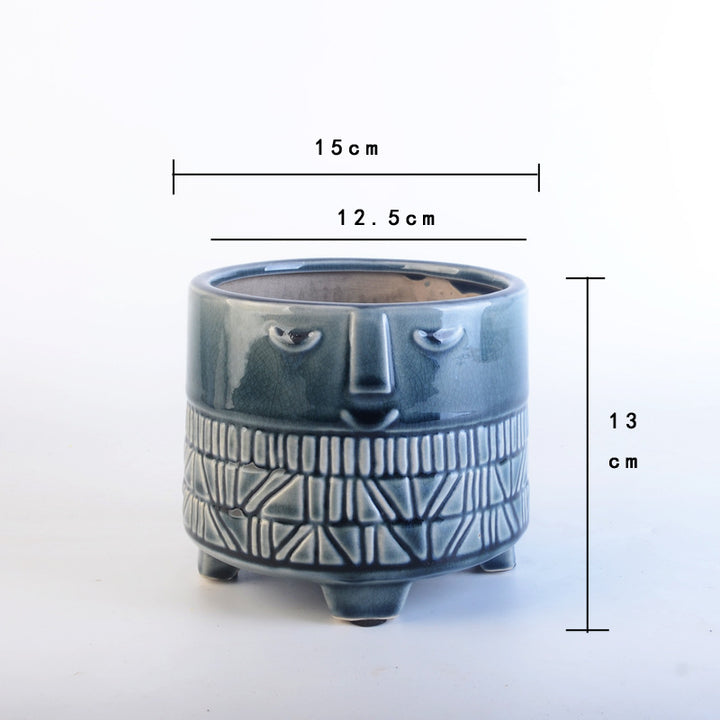 Decorative plant pot with facial features Stornfield