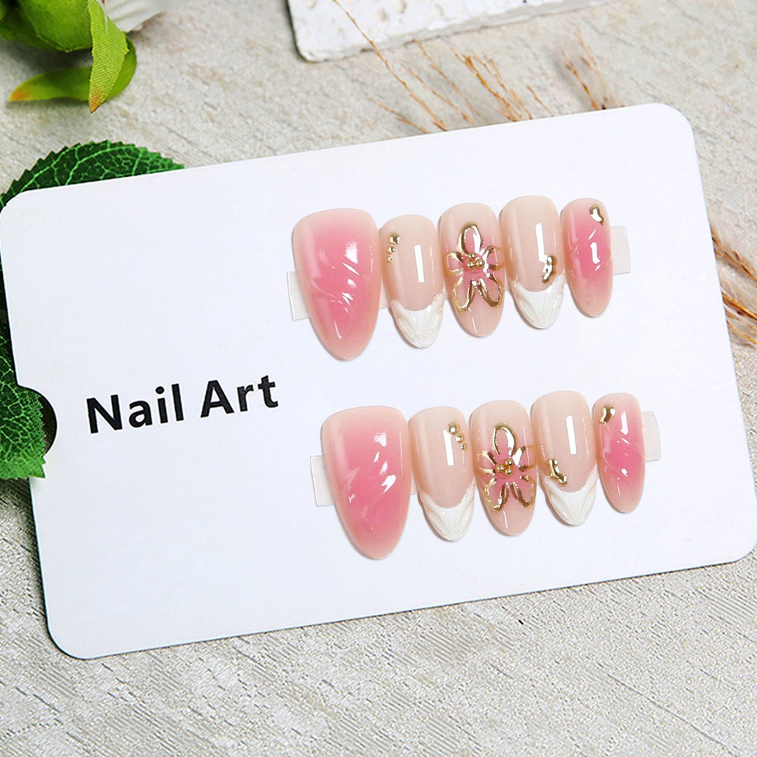 Artificial nails with floral design and glamorous accents Stornfield