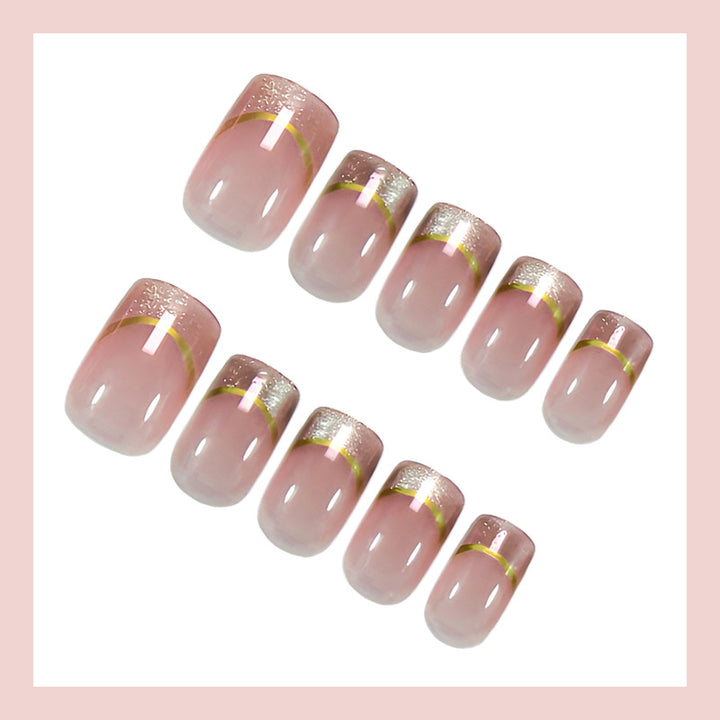 Artificial nail set with elegant glitter French tips and golden embellishments Stornfield