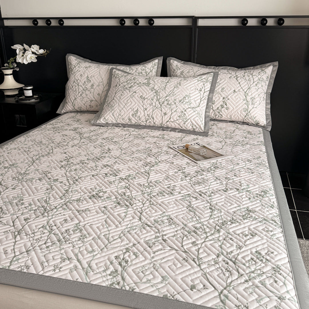 Quilted bedspread and pillow set with geometric striped quilting