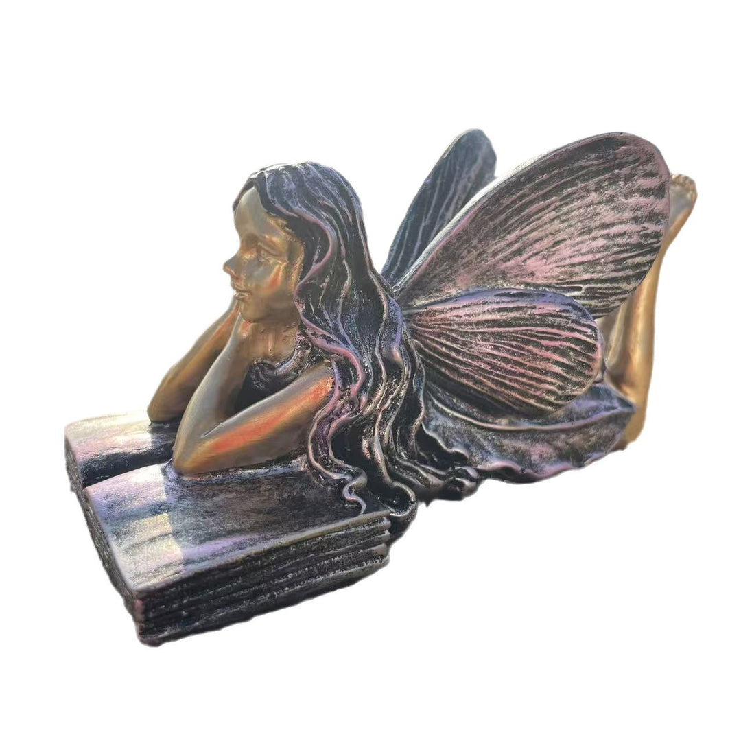 Fairy Figurine Sitting on Books Stornfield