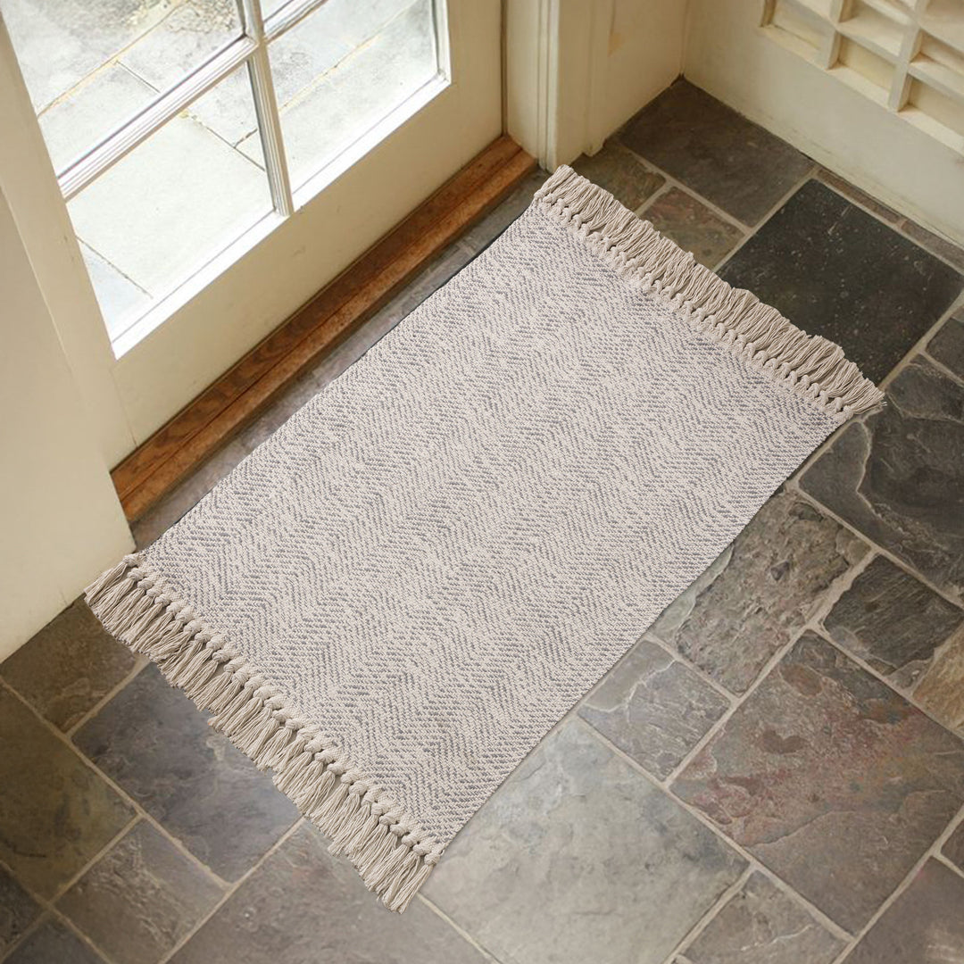 Braided runner rug with herringbone pattern and fringe edge Stornfield