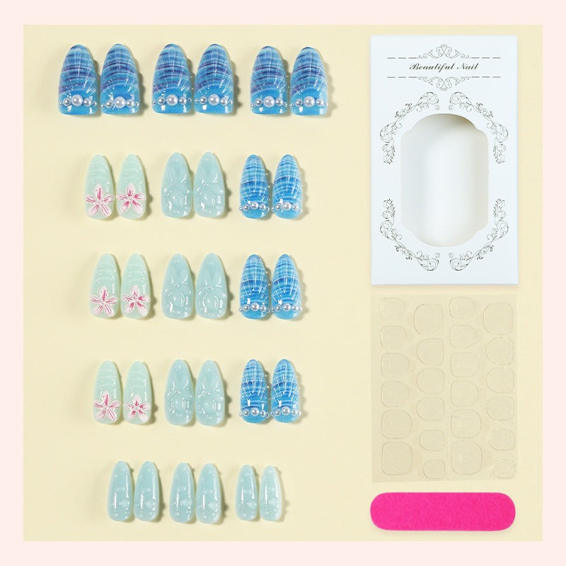 Nail art set with unique aquatic motifs and decorative accents Stornfield