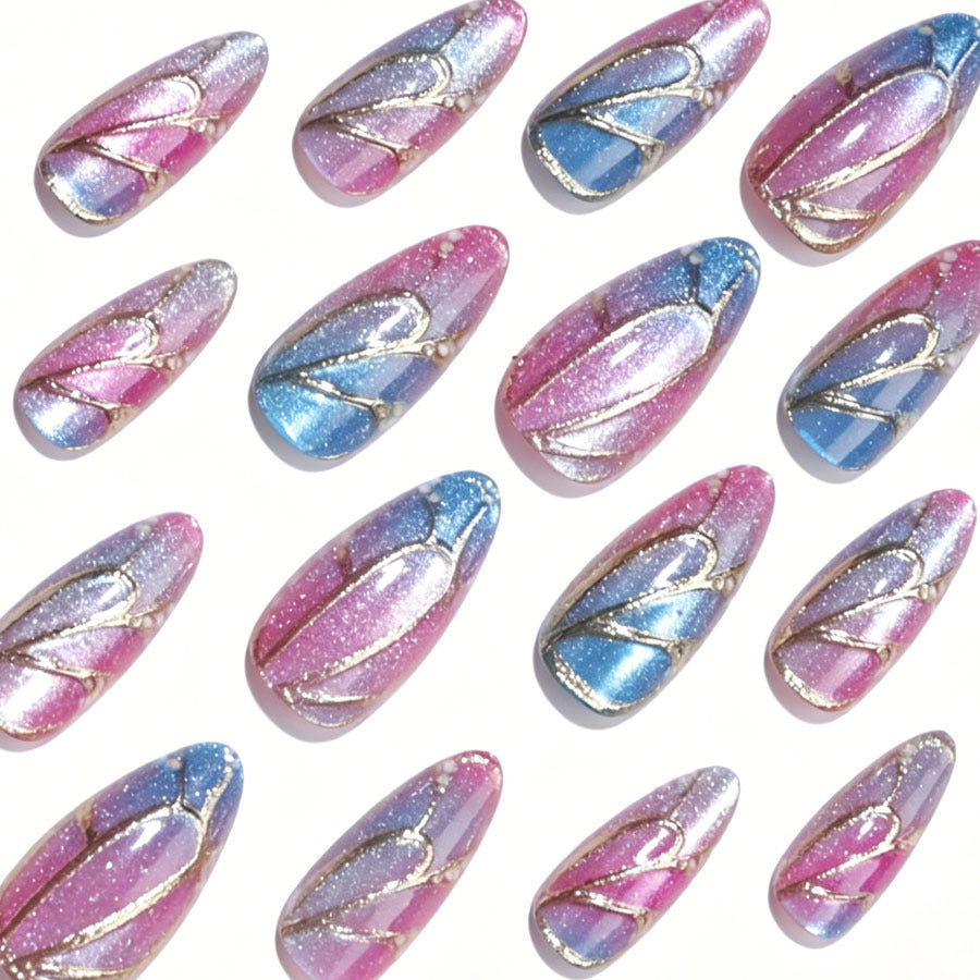 Artificial nail set with shimmering color gradients and elegant 3D details Stornfield