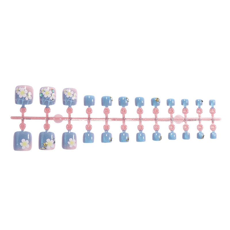 Artificial nail set with floral appliqués and glitter effects Stornfield