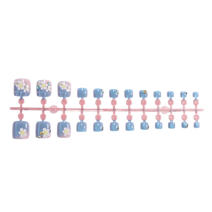 Artificial nail set with floral appliqués and glitter effects Stornfield