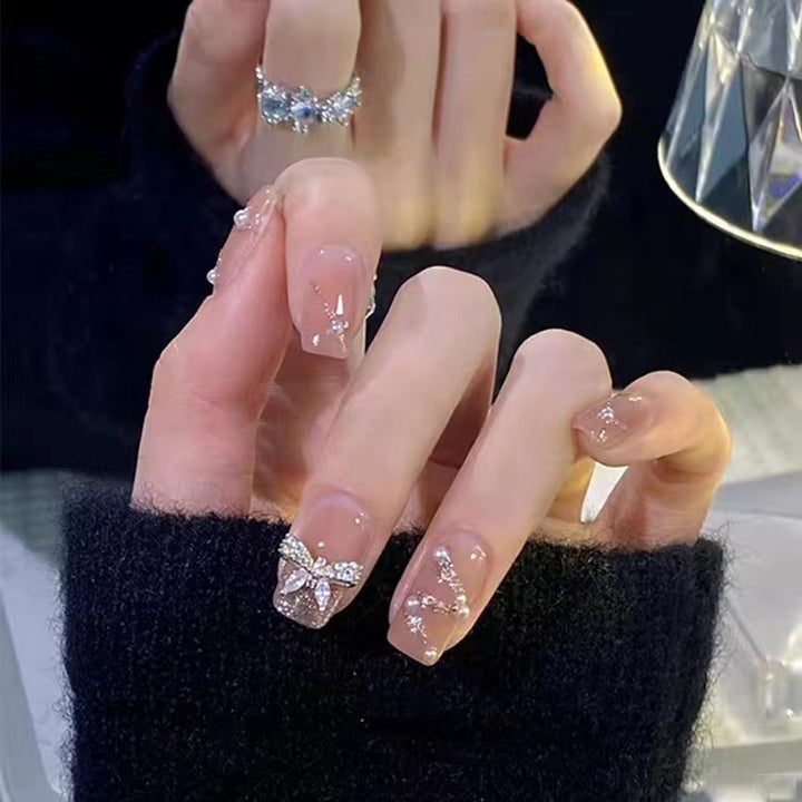 Glamorous glitter artificial nails with butterfly element Stornfield