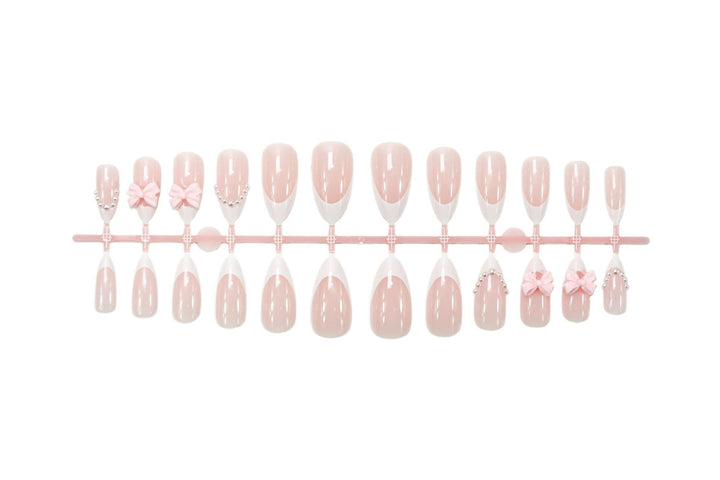 Artificial nail set with elegant bow and pearl decorations Stornfield