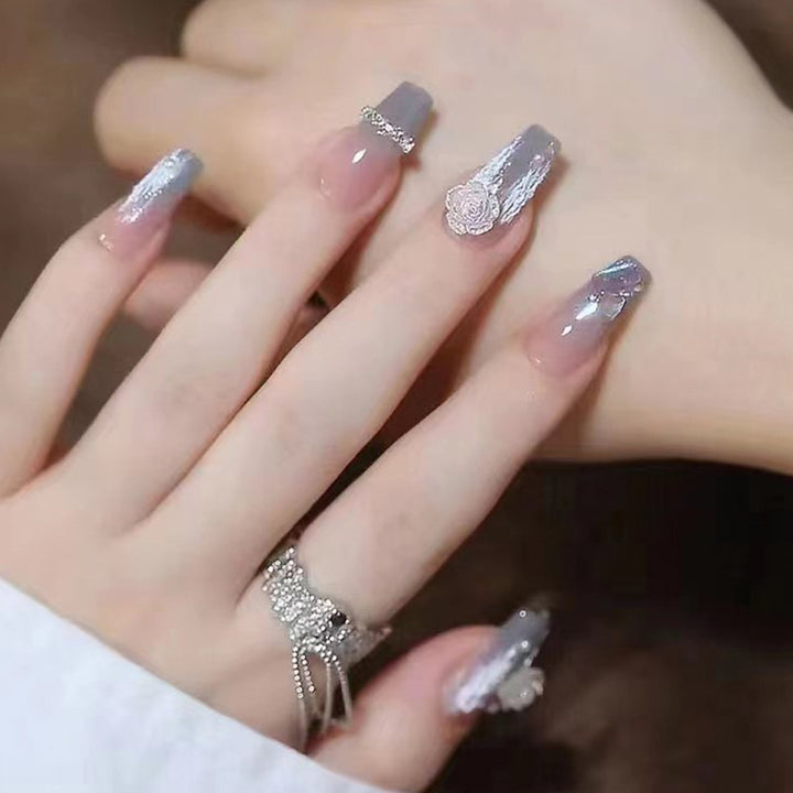 Artificial nail set with delicate rose and glitter decorations Stornfield