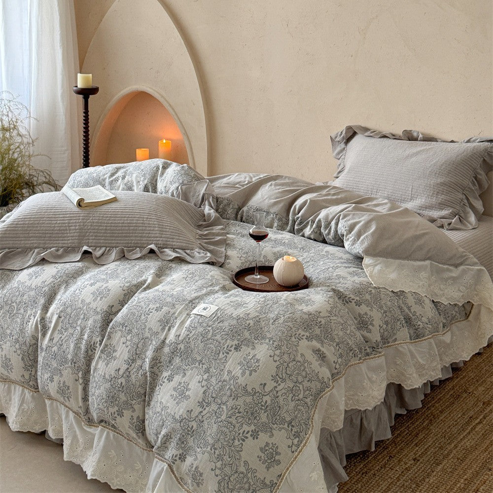 Luxurious quilted cotton bedding set with ruffles and embroidered details