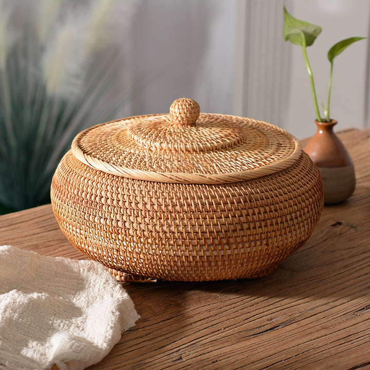 Women's round storage basket made of woven natural material Stornfield