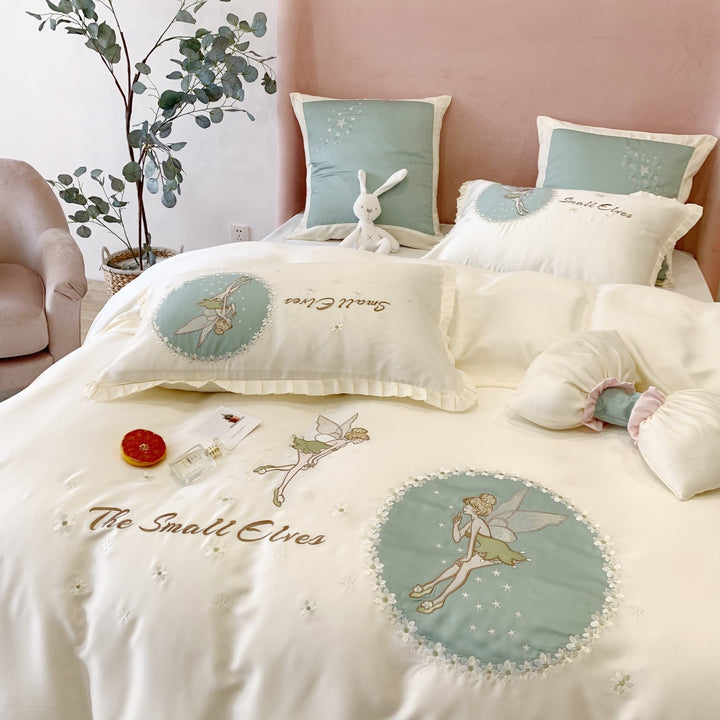 Satin bedding set with fairy embroidery, ruffled hem and decorative pillowcases