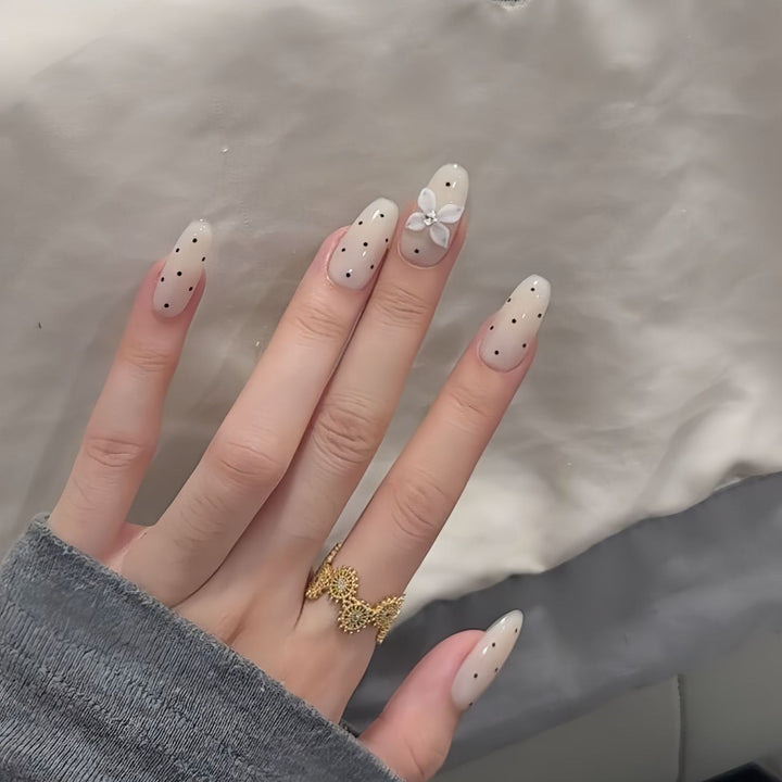 Artificial nail tips with floral and dotted accents Stornfield