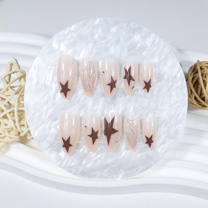 Artificial nail set with elegant star motifs and glitter accents Stornfield
