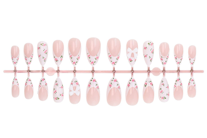Artificial nail set with romantic flower motifs and elegant details Stornfield