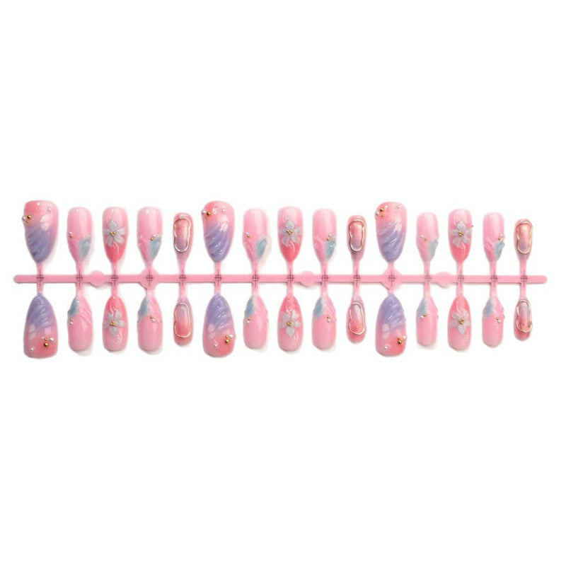 Artificial nails with flower pattern and glamorous accents Stornfield